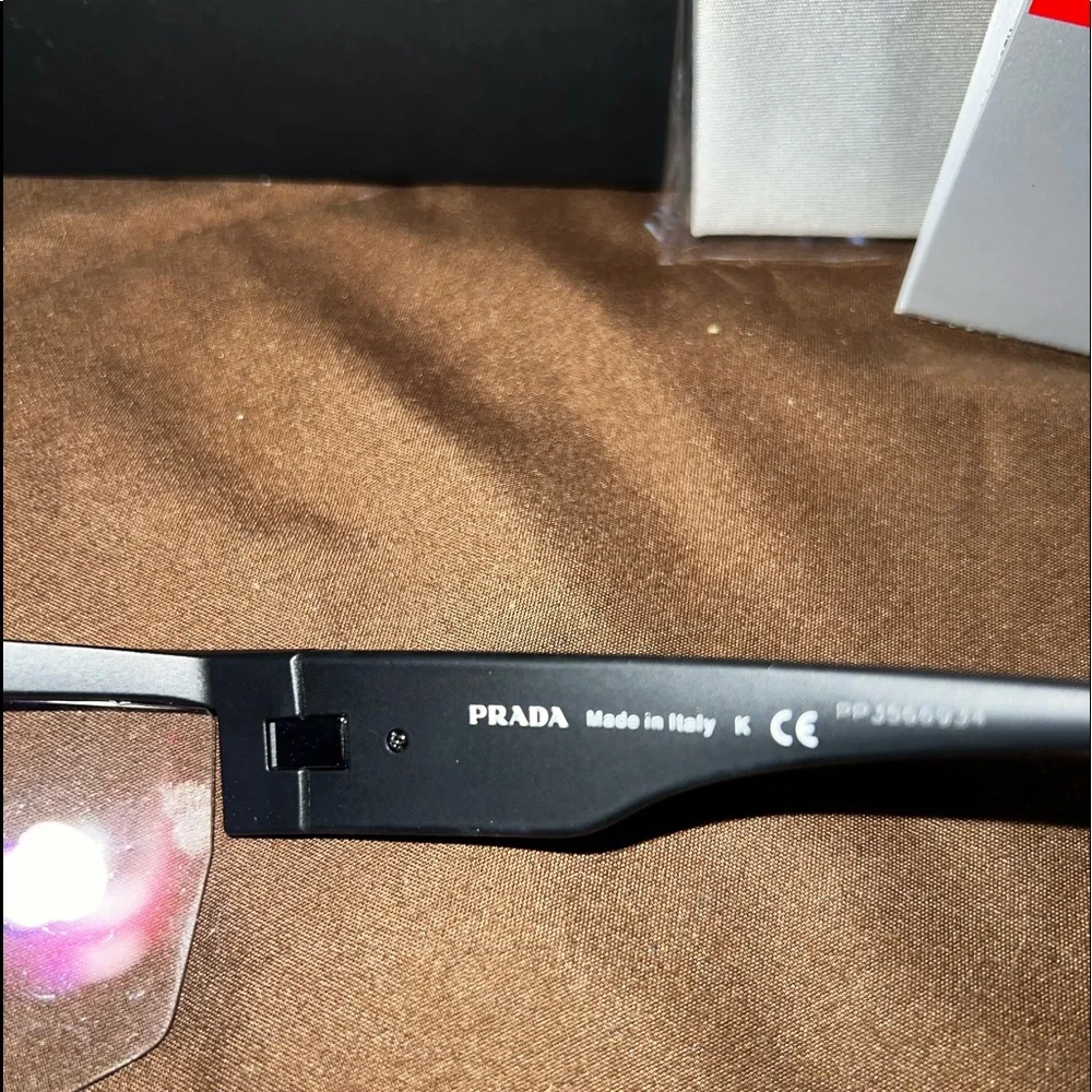 Prada Black Sunglasses with Red Accent Rimless Shield